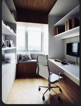 Dedicated office with built-in shelving, desk and a window seat